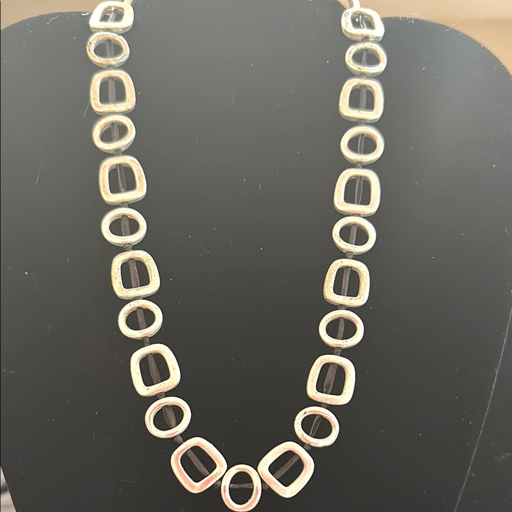 Mod look silver necklace on black cord